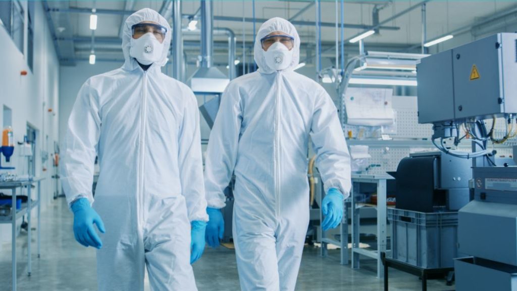two professionals in hazmat suits